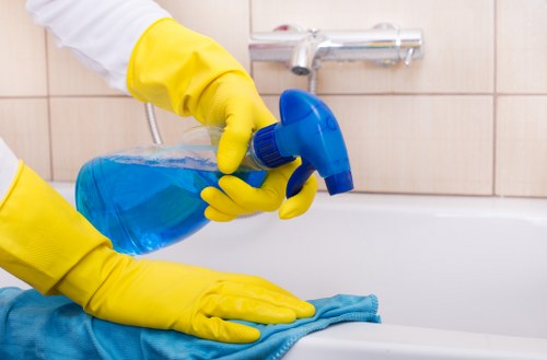 Kitchen surfaces being cleaned as part of house cleaning services