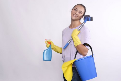 Professional housecleaningservices worker preparing a fresh, tidy bedroom