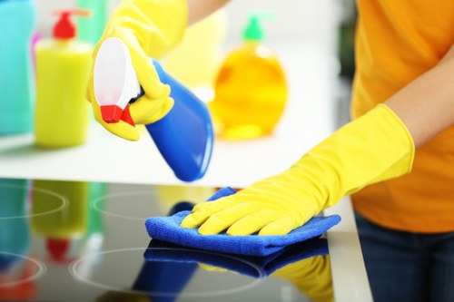 Office cleaners organizing workstations and common areas