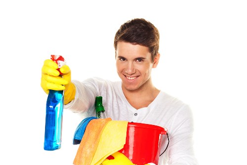 Housecleaning services maintaining a clean kitchen
